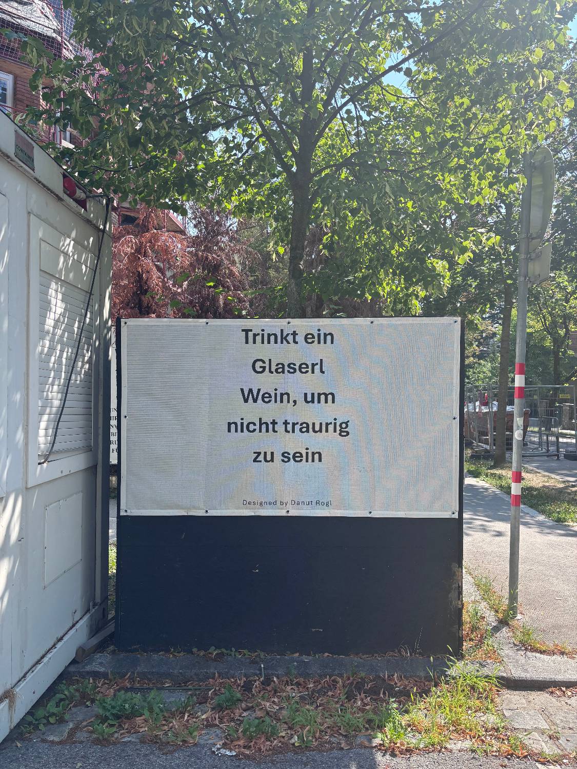 A German sign bearing the words, “Drink a glass of wine so you won’t be sad” (Photo: Courtesy of Su-jin)